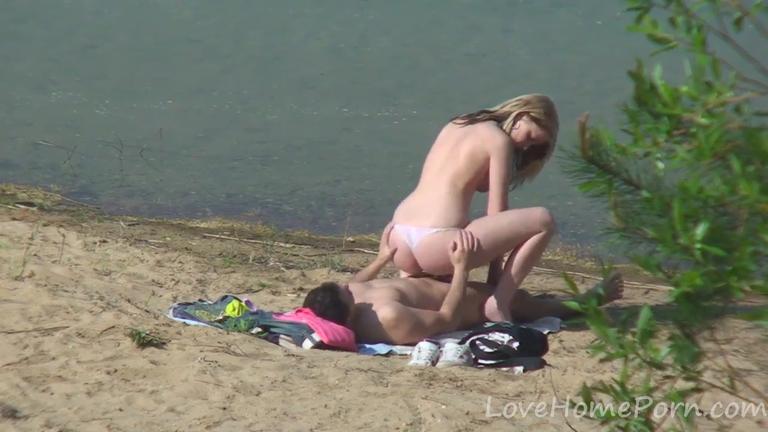 Young couple caught enjoying public beach sex