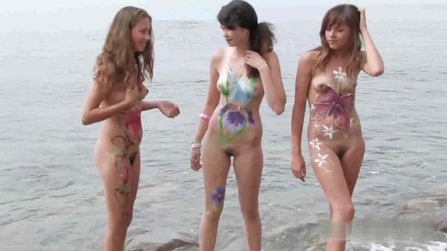 Hot teen nudists get their bodies painted on