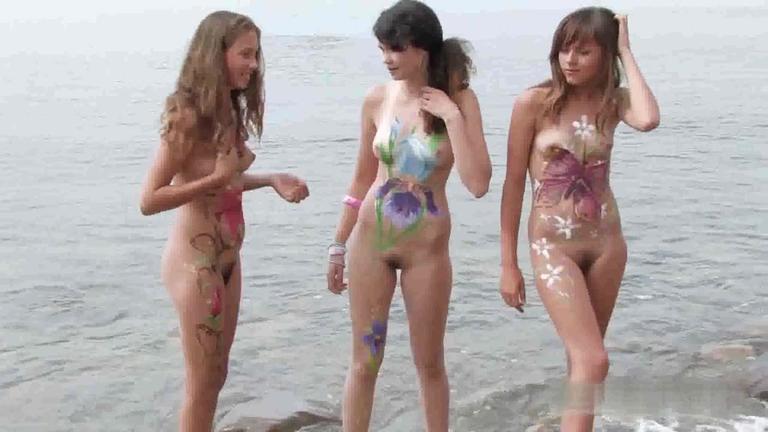 Hot teen nudists get their bodies painted on