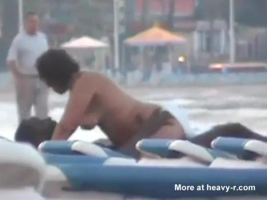 Chubby slut caught fucking a migrant man in a public beach