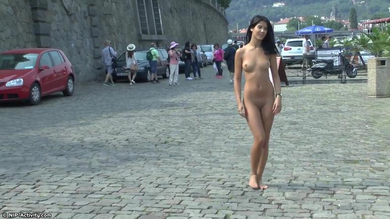 Cute young brunette gets totally naked in prague