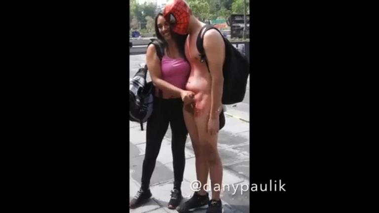 Spider-man gets jerked off to orgasm by random girl in public square